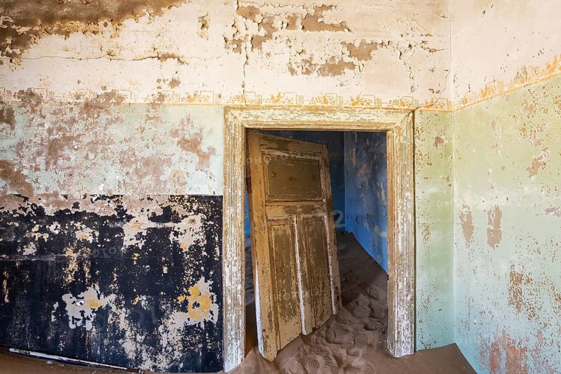 At Kolmanskop, the abandoned ghost town of the diamond days of the early 1900 and of German origin. Inside the restricted Diamond Area east of the coastal town of Lüderitz. Namib Desert, Namibia
