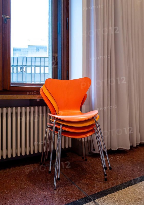 Colourful wooden chairs in the sixties style in a room in the Museum of Communication on Leipziger Straße in Berlin Mitte, Germany