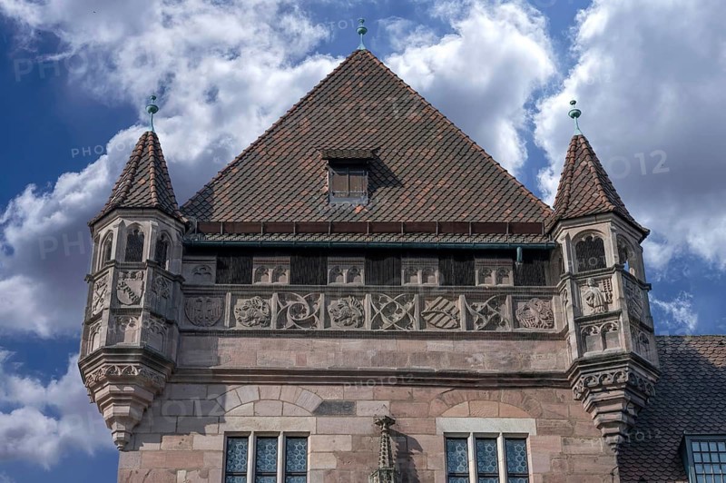 Corner tower of the Nassau house with coat of arms frieze, historic medieval residential tower, Karolinenstr, Nuremberg, Middle Franconia, Bavaria, Germany