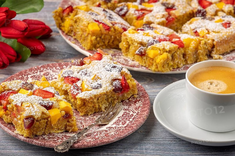 Plate of fruit cake served with coffee