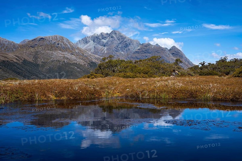 Mountain landscape with lake on the Key Summit Track hiking trail. Fiordland National Park, Southland Region, South Island, New Zealand