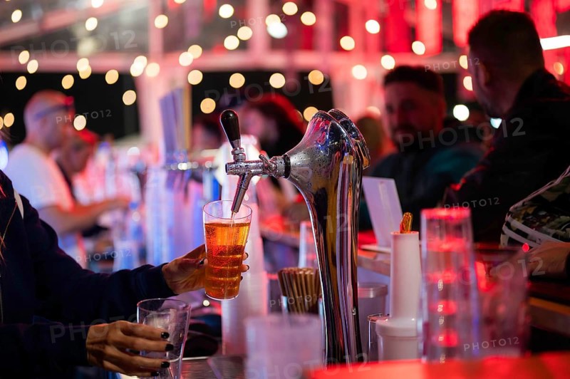 Pouring draft beer into a mug in a pub