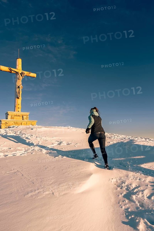 Summit bliss in the snow-covered winter landscape in the Tannheimer Tal in the Alps on the Neunerköpfle, Tyrol, Austria