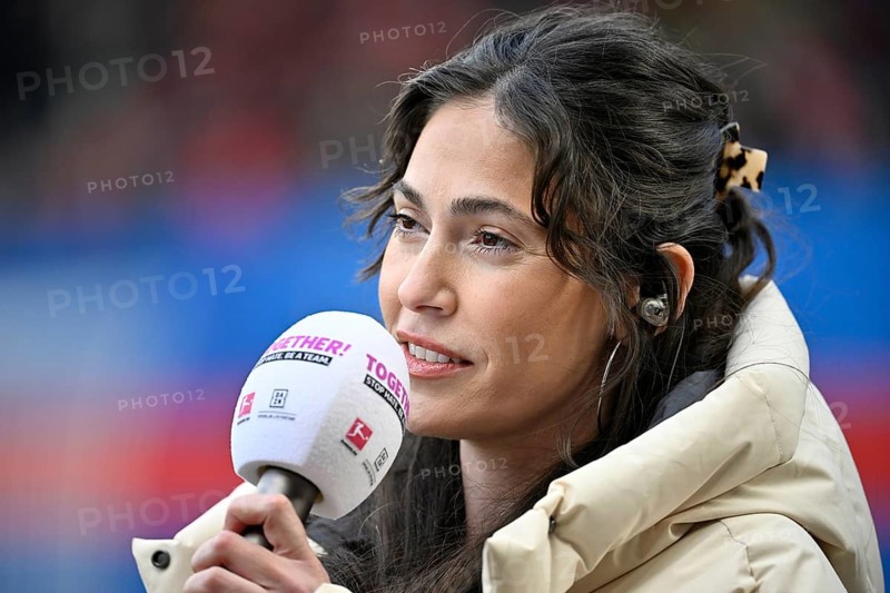 Interview microphone logo in hand by DAZN presenter reporter Ann-Sophie Kimmel portrait action day TOGETHER Stop Hate soccer Bundesliga, Voith-Arena, Heidenheim, Baden-Württemberg, Germany