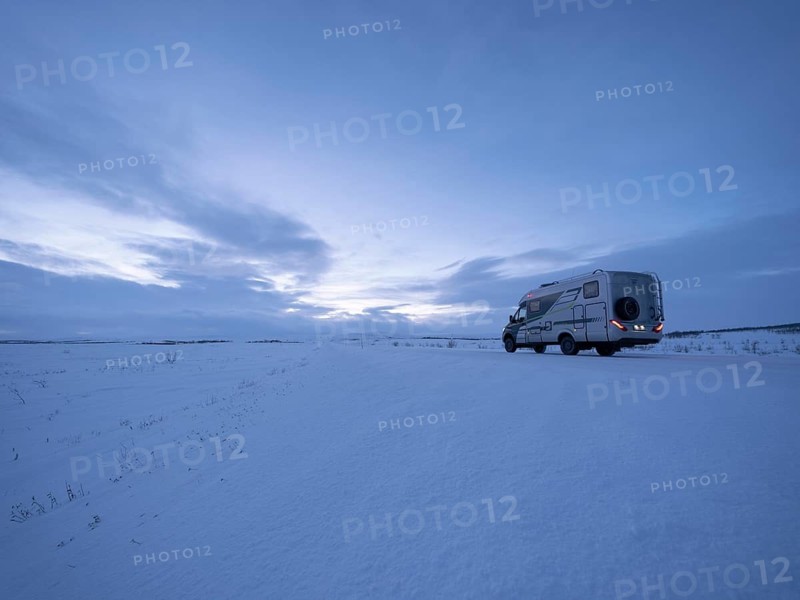 Motorhome on the arctic tundra plain in winter, Finnmark, Norway