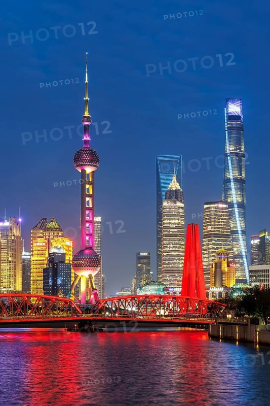 Shanghai skyline at the Bund with Oriental Pearl Tower city centre downtown at night in Shanghai, China