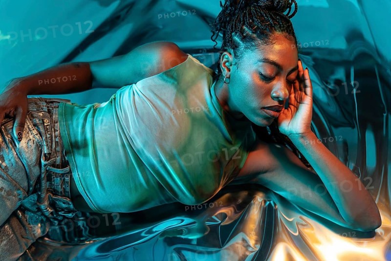 A futuristic young African woman immerses in a vibrant metaverse, surrounded by a surreal, glowing ambiance. Her modern, dynamic presence embodies digital innovation