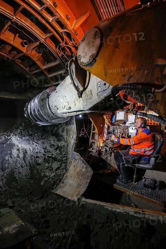 Theme photo Emscher conversion, the Emscher system will be wastewater-free in 2021 - new construction of a sewer on the Boye, the second largest tributary of the Emscher, a machine operator in the tunnelling machine digs the tunnel for the DN 3500 concrete wastewater pipes, the Boye is renaturalised and transformed into a near-natural body of water, was previously an open, above-ground wastewater sewer, mixed sewer with surface water and wastewater, the ecological conversion of the Emscher system consists of the construction of a central wastewater treatment system in the Ruhr area, the construction of sewers and the renaturalisation of the Emscher and its tributaries, archive photo from 13.11.2014, Bottrop, Ruhr area, North Rhine-Westphalia, Germany - -