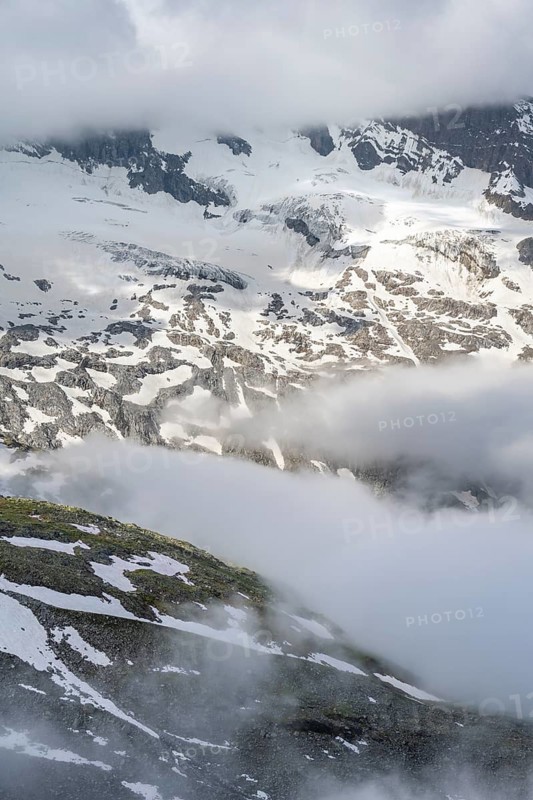 Mountain landscape with clouds and glacier Schlegeiskees, Berliner Höhenweg, Zillertal Alps, Tyrol, Austria