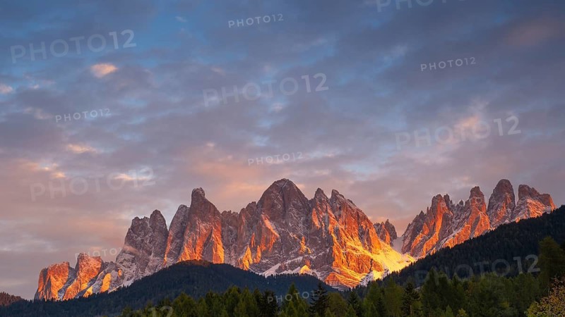 View of the Geissler group, intensely illuminated by the sun, evening light, Dolomites, Puez-Geisler nature park Park, St. Magdalena, Funes, Funes Valley, South Tyrol, Italy