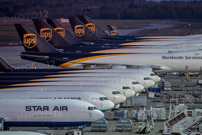 Cologne-Bonn airport, CGN, air freight center, UPS Logisic Hub, UPS cargo aircraft on the apron, Star Air Cargo aircraft, Maersk, at the logistics center, in the evening