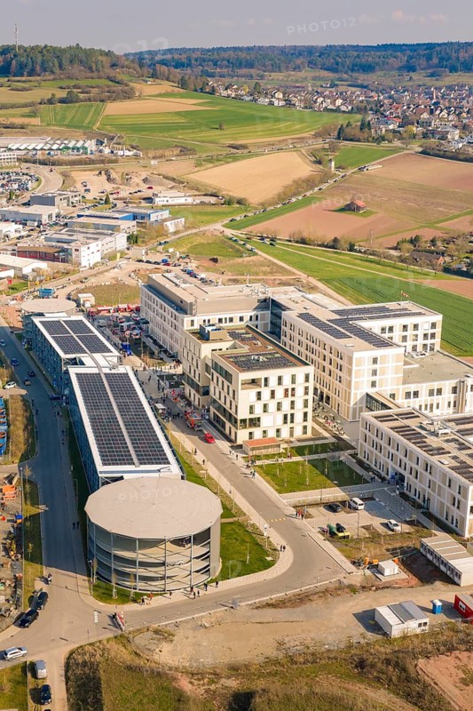 Panoramic view of a building complex in a landscape with fields, hospital opening, Calw, Germany