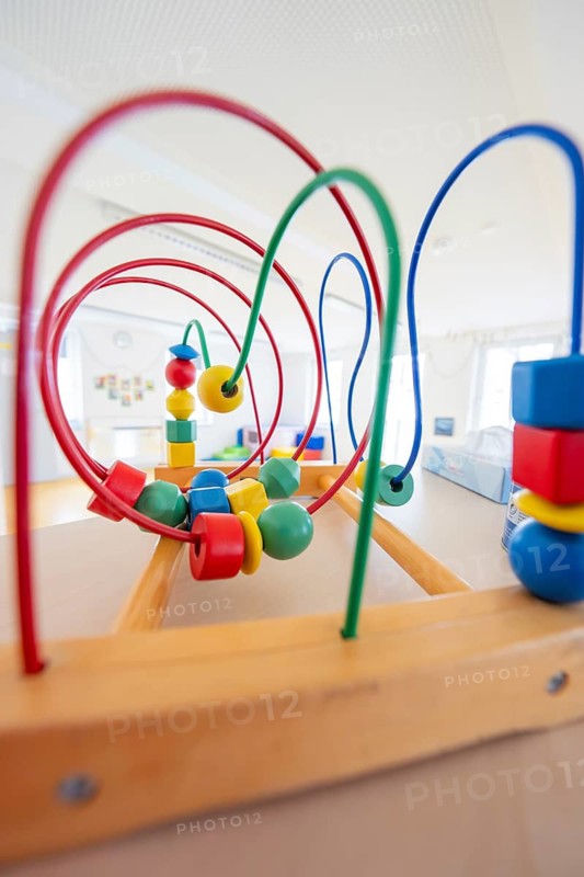Detail of a wooden toy with colorful beads and wires in a room, children's house, Calw, Germany