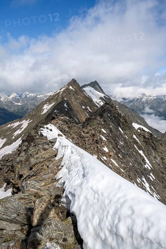 Rocky summit with snow, summit of the Schönbichler Horn, Berliner Höhenweg, Zillertal Alps, Tyrol, Austria