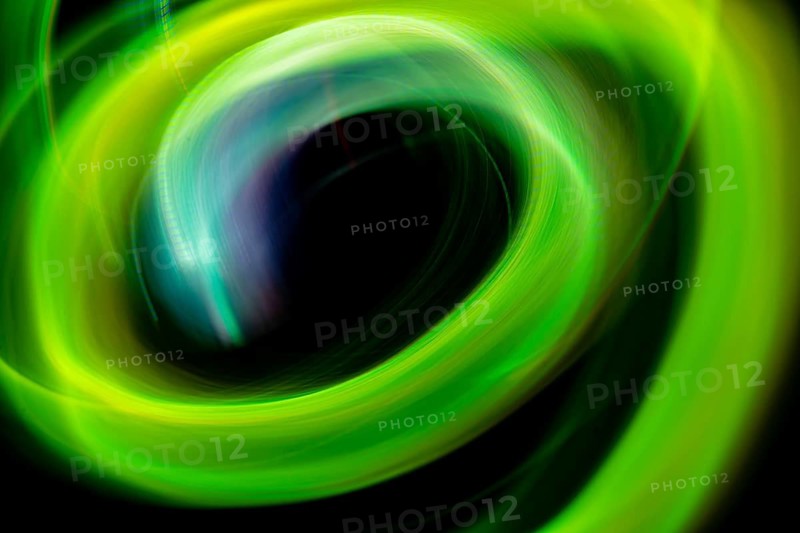 A dynamic swirl of vibrant green neon lights creating an abstract, ethereal pattern, captured using long exposure photography for a mesmerizing visual effect