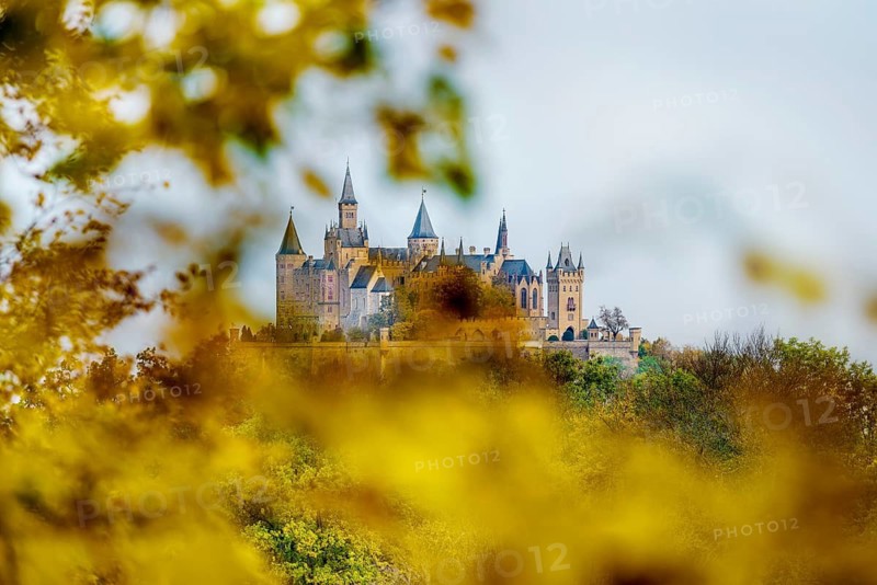 Castle and autumnal forest, Hohenzollern Castle, Hechingen, Swabian Jura, Baden-Württemberg, Germany