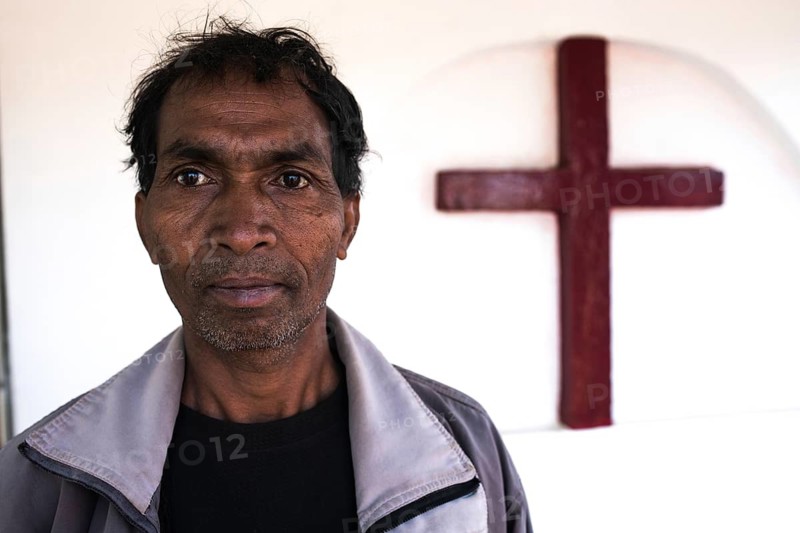 Portrait of a christian man in tribal Odisha, India. He is a disciple of the Church of North india. He lives in a far-off village in the Kandhamal district where various churches have led strong efforts of evangelization in tribal areas