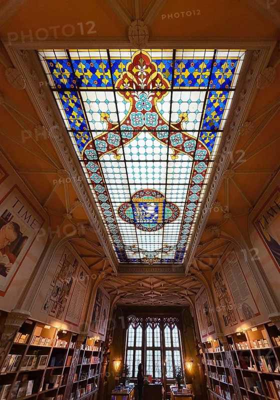 Livraria Lello, interior of the Lello bookstore on the upper floor with the magnificent ceiling glass window by Samuel Van Krieken, Porto, Portugal