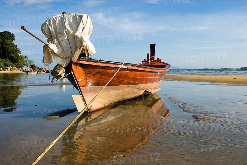 Longtail boat on the shores of Nai Yang Beach in the north of the Thai holiday island Phuket, Thailand, Asia, Southeast Asia, holiday island, boat, boats, longtail boats, reflection, mirrored, water reflection, stranded, dried