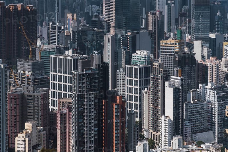 Aerial view of Hong Kong's bustling skyline showcases a dense cluster of modern skyscrapers, highlighting the city's vibrant architecture and urban density