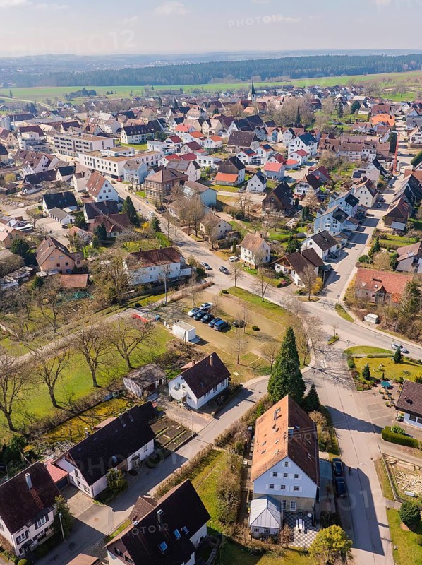 Houses with red roofs in a village, surrounded by streets and green areas, photographed from a bird's eye view, Nagold Hochdorf, district of Calw, Germany
