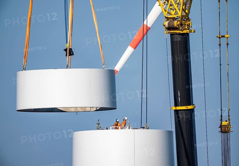 Construction site of the new Bedburg 3 wind farm, on recultivated open-cast mining site, 9 wind power plants with an output of 60 megawatts are being built, installation of the wind turbine tower operated by RWE and the city of Bedburg, North Rhine-Westphalia, Germany