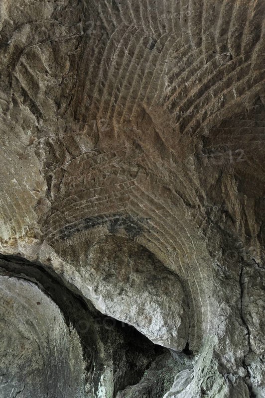 Grooves in the sandstone rock from carving millstones at the Hohllay cave in Berdorf, Little Switzerland, Mullerthal, Grand Duchy of Luxembourg