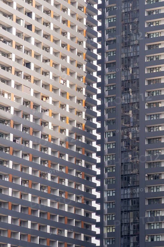 A detailed view of modern skyscrapers in Georgia, showcasing striking geometric patterns and the urban architectural growth in the city center
