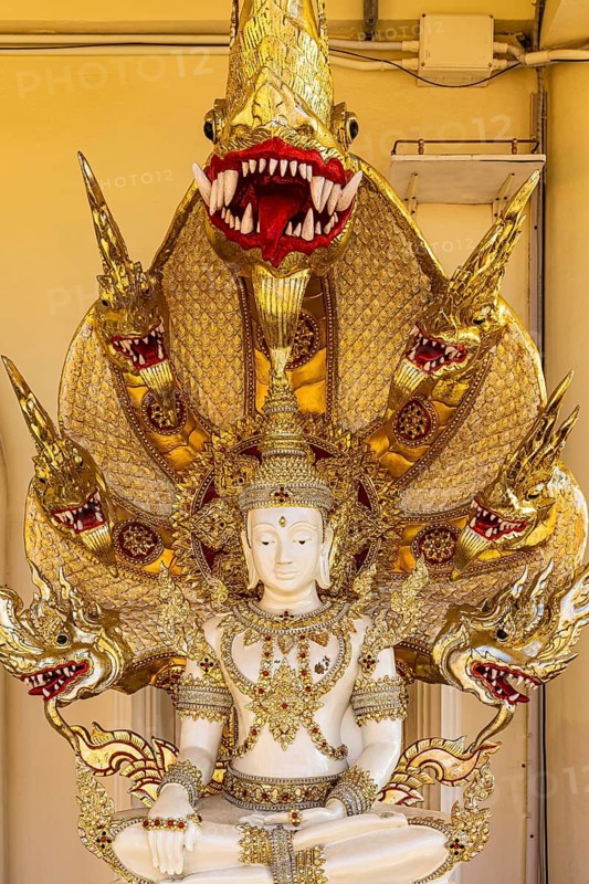 Meditating Buddha figure protected by a multi-headed snake, Buddhist temple complex Wat Phra That Sorn Kaew, Phetchabun province, Thailand