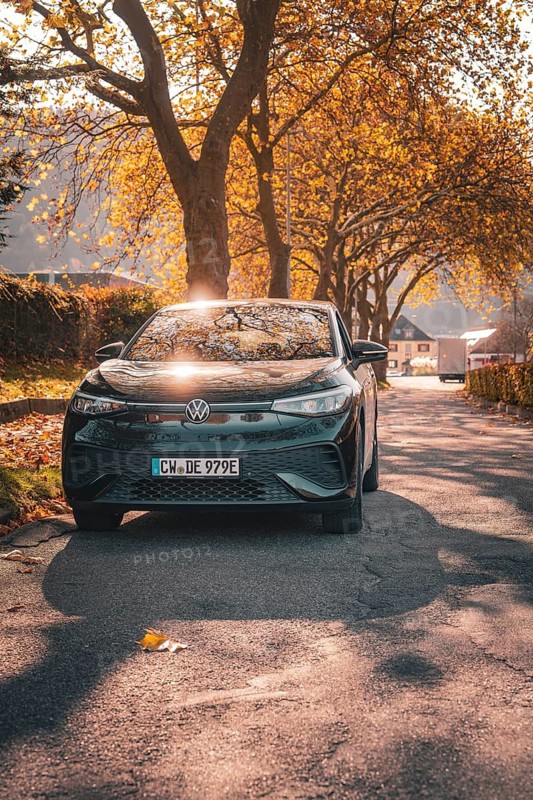 Car in the sunlight on a tree-lined road, electric car VW ID5, Deer Carsharing, Gechingen, Black Forest, Germany