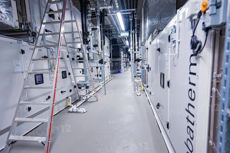Industrial ventilation system with a ladder and structured machines in a neutral color, ventilation system, technical room, Calw, Germany