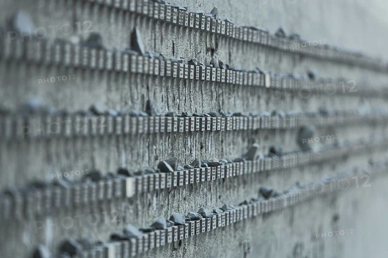 Memorial to the Holocaust during the Nazi era and persecution of Jews, concentration camp, series of endless grey stones with names, monochrome, list of names, lines, depth blur, wall at the Jewish cemetery, Neuer Börneplatz, Frankfurt am Main, Hesse, Germany