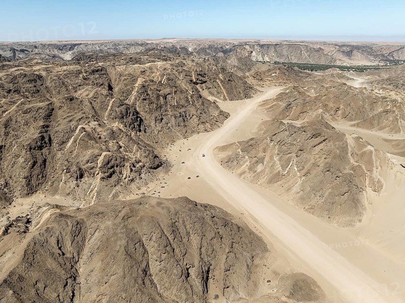 Aerial view, dry barren mountains in Moon Valley, rocky landscape ridged by erosion, Namib-Naukluft Park, Namib Desert, Namibia