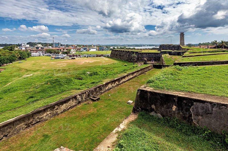 View across the fortress walls of the cityscape under cloudy sky, The Fortress of Galle in Sri Lanka