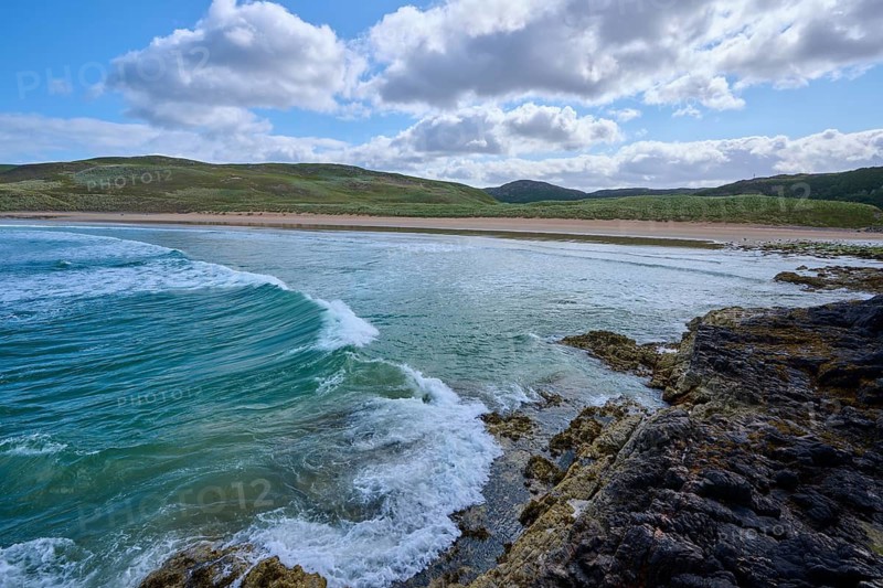 Waves break on a rocky coast under a mostly cloudy sky, Farr Bay, Bettyhill, Thurso, Scotland, United Kingdom, Great Britain