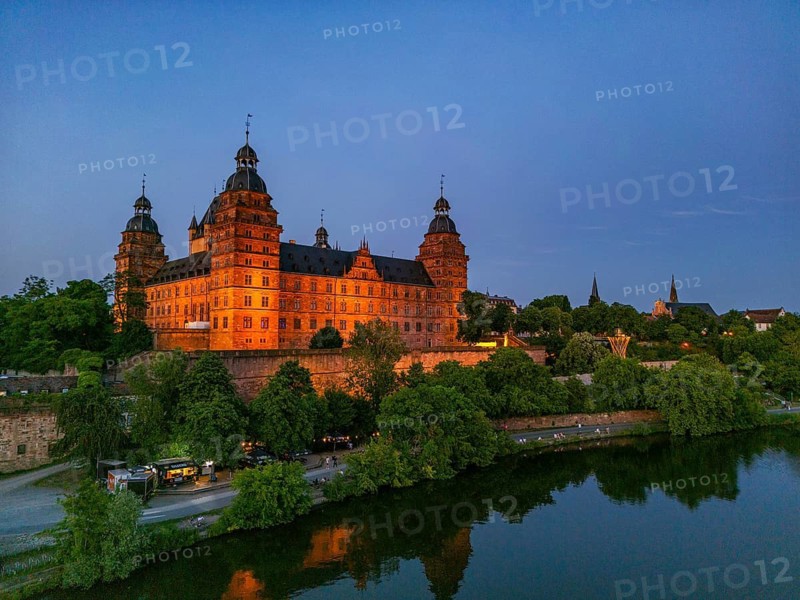Aerial view, drone photo: Johannisburg Castle illuminated in the evening and castle terrace over the Main, Aschaffenburg, Lower Franconia, Bavaria, Germany