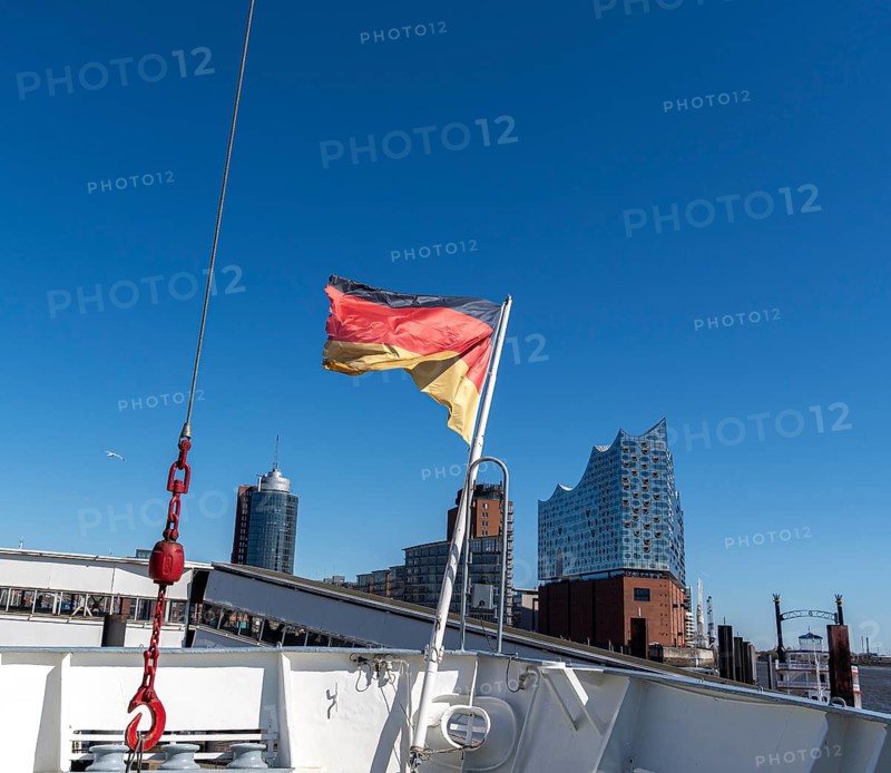 German flag on the bow of the museum ship Cap San Diego, Elbe Philharmonic Hall in the background, Hamburg, Germany