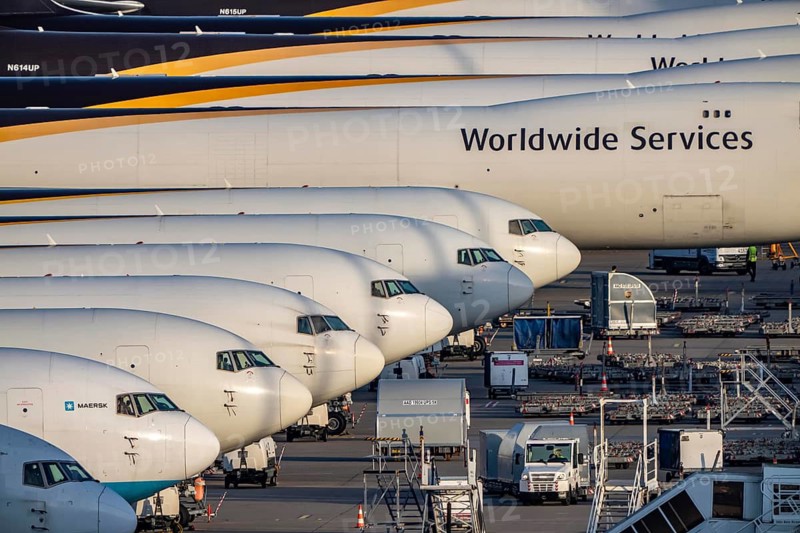 Cologne-Bonn airport, CGN, air freight center, UPS logisic hub, UPS cargo aircraft on the apron, at the logistics center, Boeing 747 freighter in the back