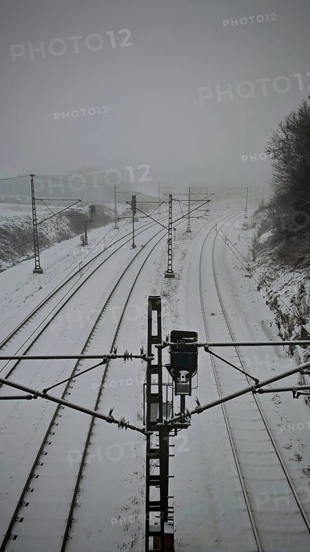 Lonely snow-covered tracks in a foggy winter landscape, Rennsteig, Frankenwald nature park Park