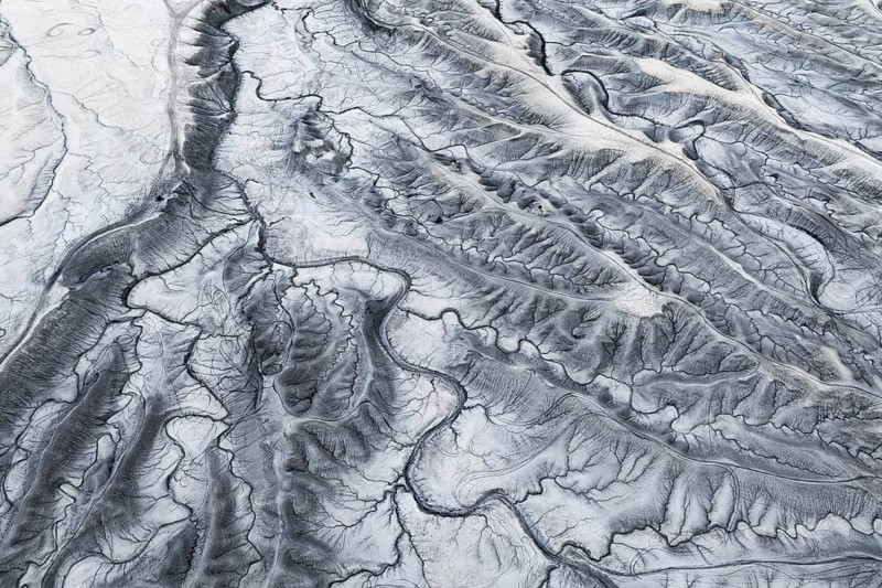 Captivating aerial image of Moonscape Overlook in Utah with a detailed view of the textured and rugged landscape resembling the lunar surface