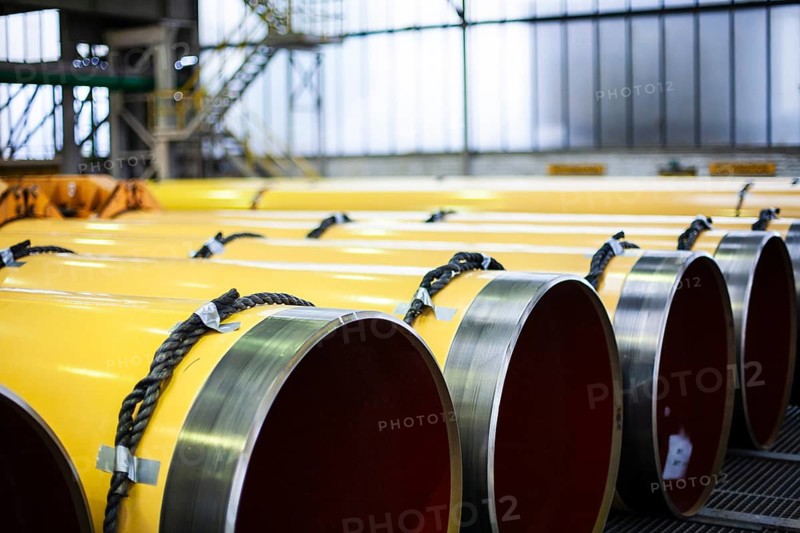 A series of large yellow pipes in an industrial building, Düsseldorf, Germany
