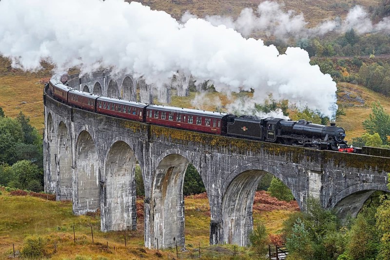 Scotland. Glenfinnan Viaduct, a renowned feat of Victorian engineering and the longest concrete railway bridge in Scotland. Hogwarts Express train made famous by the Harry Potter