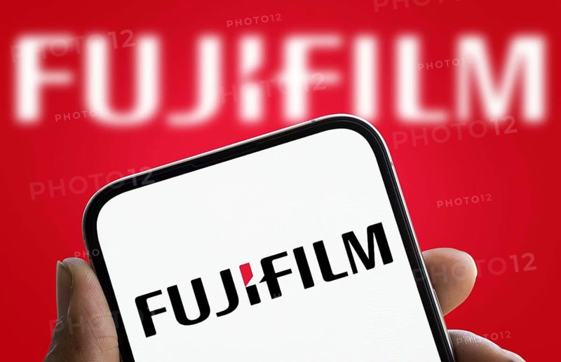 Fujifilm logo is displayed on smartphone. Fujifilm Holdings Corporation is a Japanese multinational conglomerate company