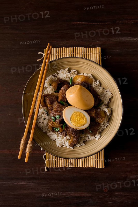 Stewed eggs, with pork belly, and rice, chinese food, homemade, selective focus, rustic, no people