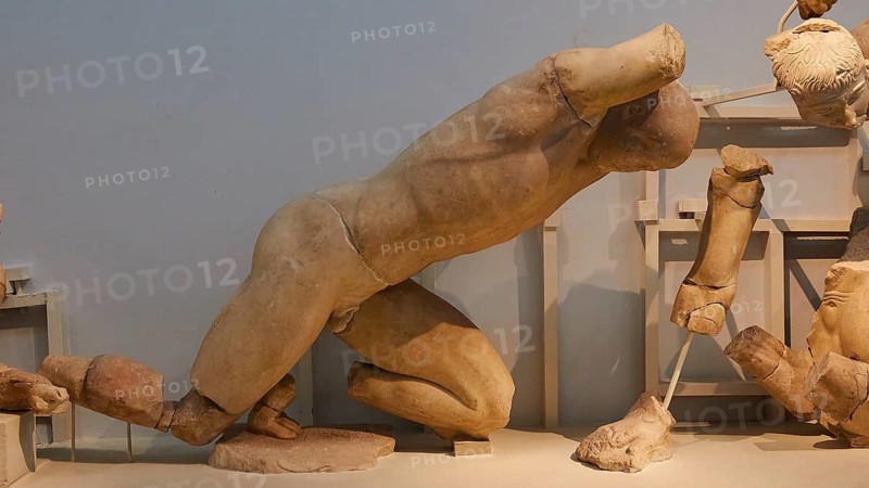 West Gable of the Temple of Zeus, Battle between Lapiths and Centaurs, Damaged Ancient Marble Sculpture of a Kneeling Male Figure, Olympia Archaeological Museum, Ancient Olympia, Peloponnese, Greece