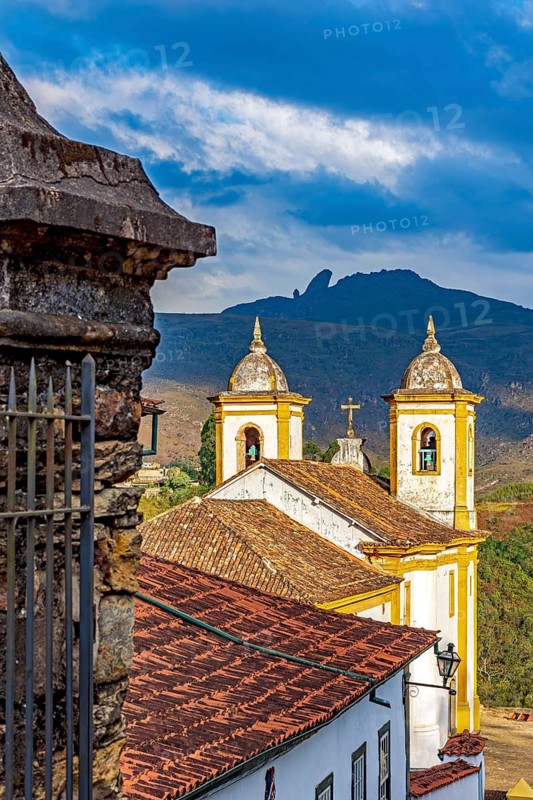 Historic baroque church in the city of Ouro Preto in Minas Gerais, with the mountains in the background