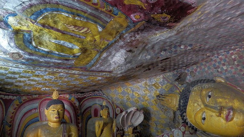 Ancient Buddha figures and wall paintings, colorful and spiritual scene, Dambulla cave temple, Sri Lanka