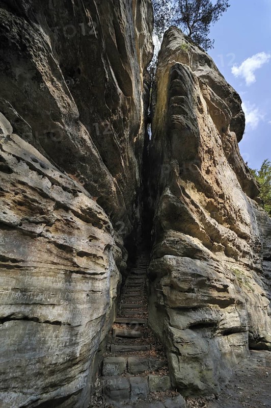 Trail with stairs leading through narrow gorge in the sandstone rock formation Perekop in Berdorf, Little Switzerland, Mullerthal, Grand Duchy of Luxembourg