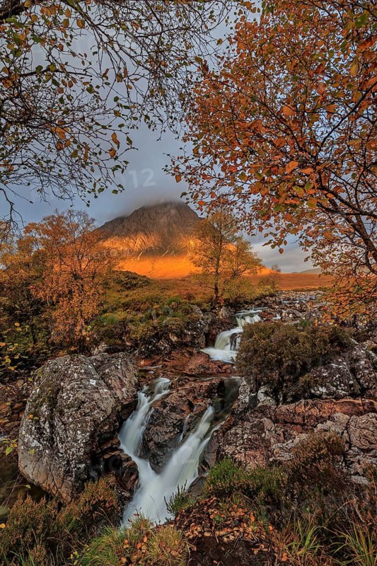 Wild river, waterfall, autumn colours, morning light, mountain landscape, cloudy mood, Buachaille Etive Mòr, Glencoe, Scottish Highlands, Scotland, Great Britain