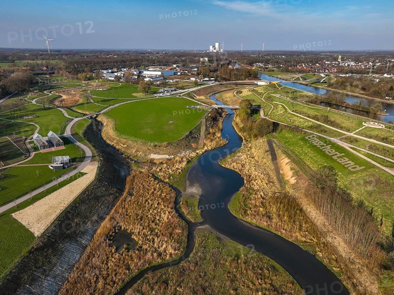 Castrop-Rauxel, North Rhine-Westphalia, Germany - EMSCHERLAND adventure park, new nature and water adventure park on the restored Emscher, at the Emscher water cross with the Rhine-Herne Canal on the city limits of Recklinghausen to Castrop-Rauxel. A new vineyard in front. Flood protection through area expansion. The ecological focus at the confluence of the Suderwicher Bach and Emscher rivers will also be a future garden of the IGA 2027 International Garden Exhibition. Before the restoration, the river system of the Emscher was an open, aboveground waste water channel, mixed water channel with surface water and waste water. Back right, the new bridge jump over the Emscher. On the horizon, the Datteln 4 power plant